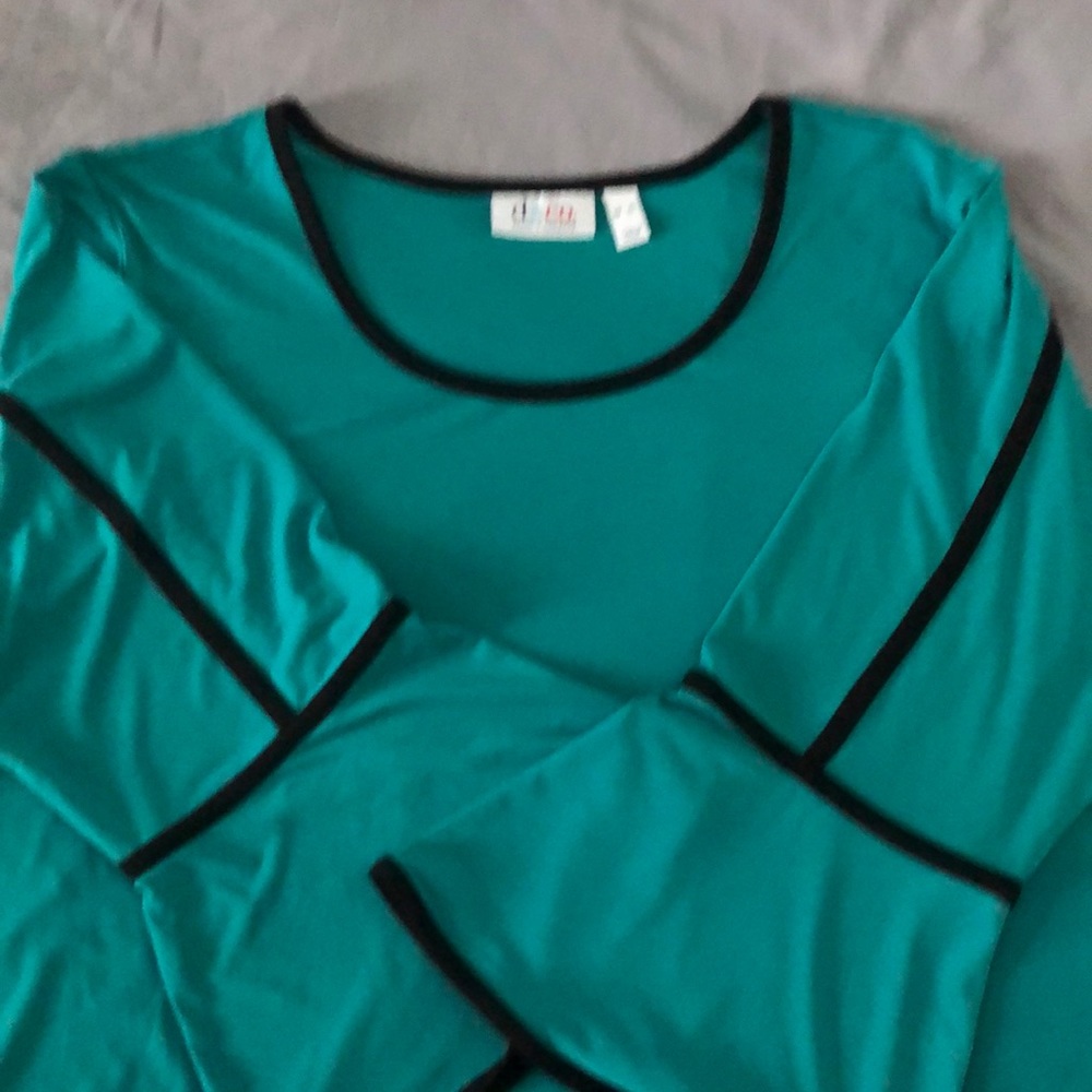 Dressy turquoise D&Co blouse with bell sleeves with black accent lines. Like new